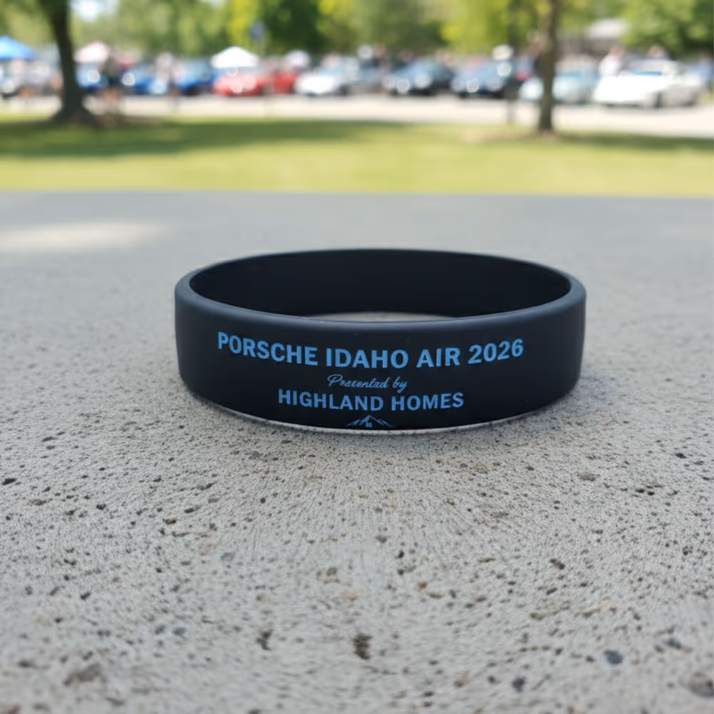 2026 dark wristband concept with event and sponsor lettering
