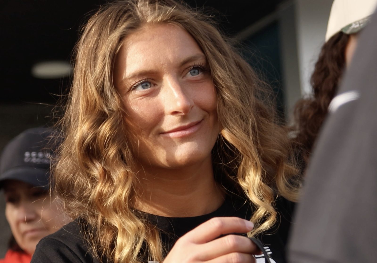 Close-up of a smiling Idaho Air volunteer with long wavy hair